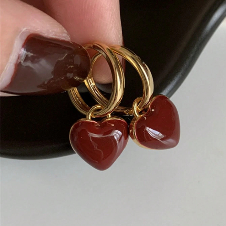 Hoop earrings with a red heart
