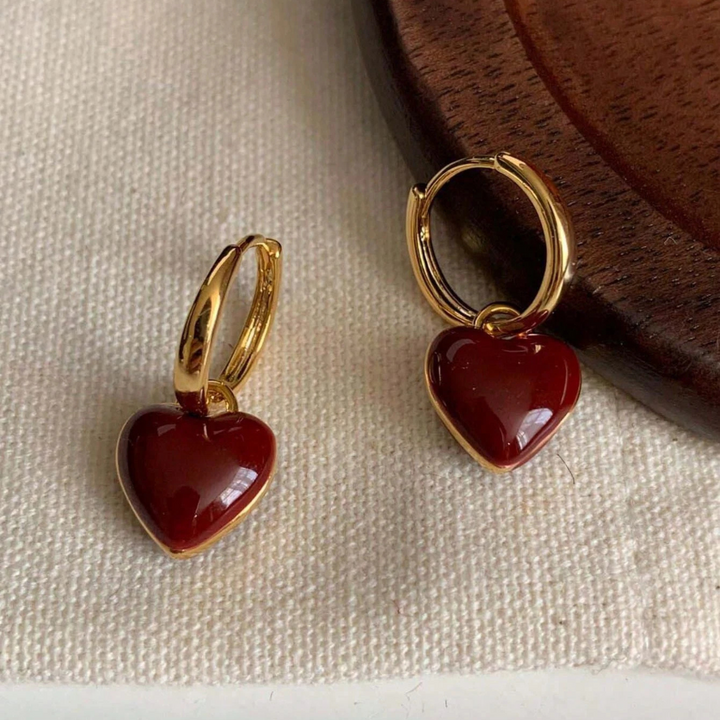 Hoop earrings with a red heart