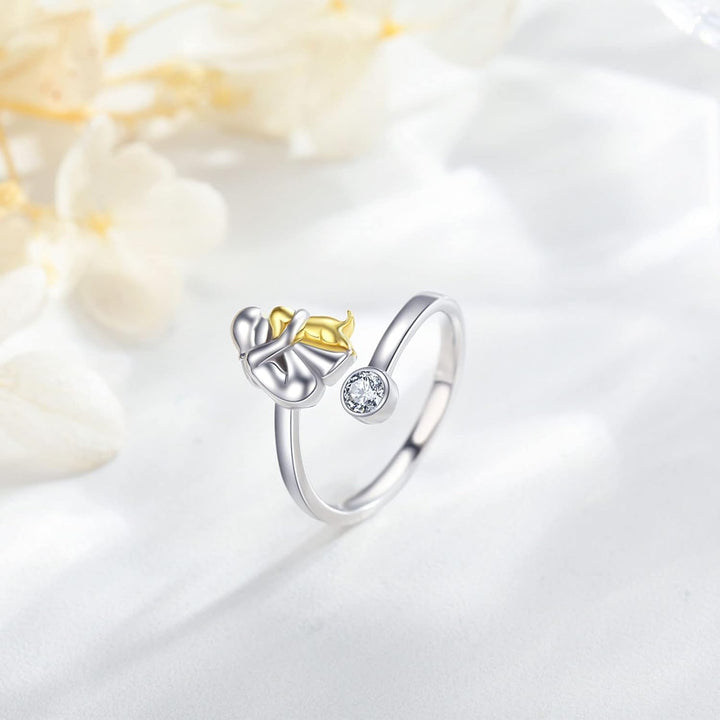 Silver ring with puppy and zirconia stones.