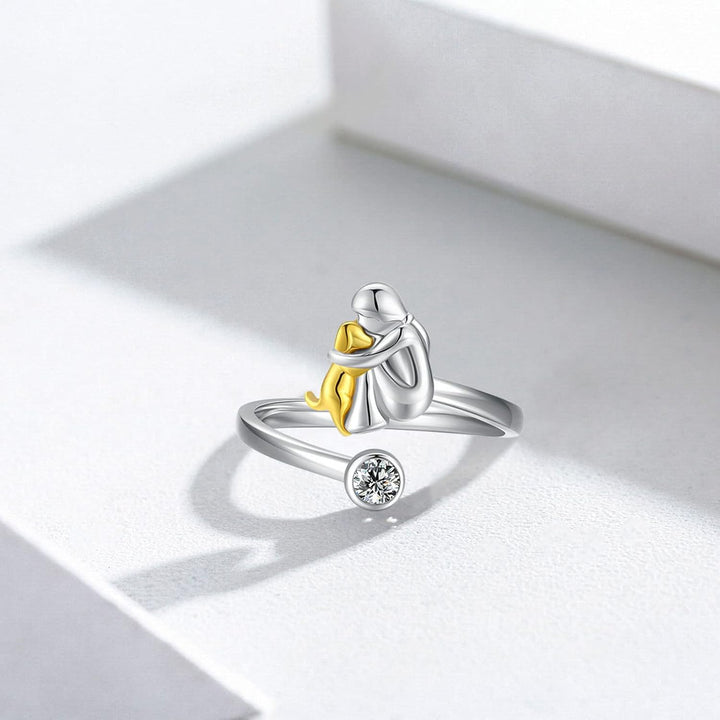 Silver ring with puppy and zirconia stones.