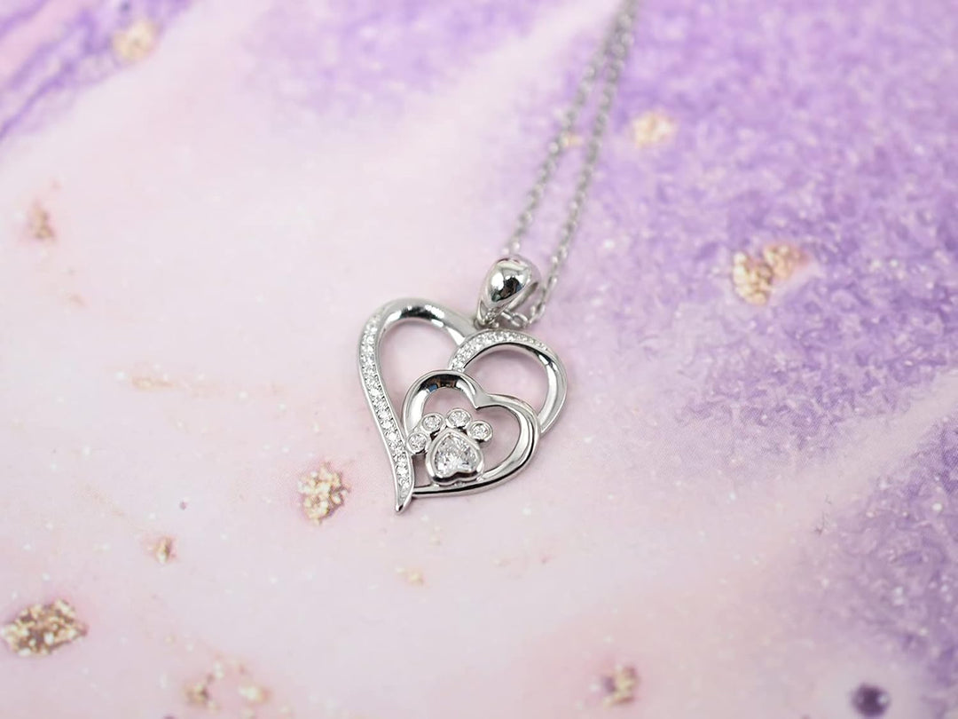 Sterling silver necklace with paw print and hearts, set with zirconia.