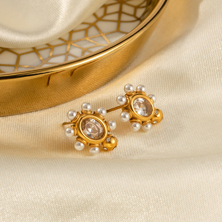 Elegant gold earrings with pearl