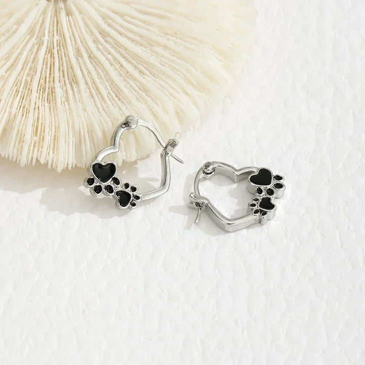Huggie earrings with hearts and black enamel.