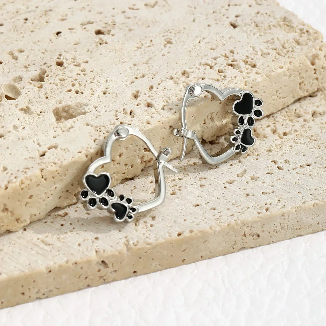 Huggie earrings with hearts and black enamel.