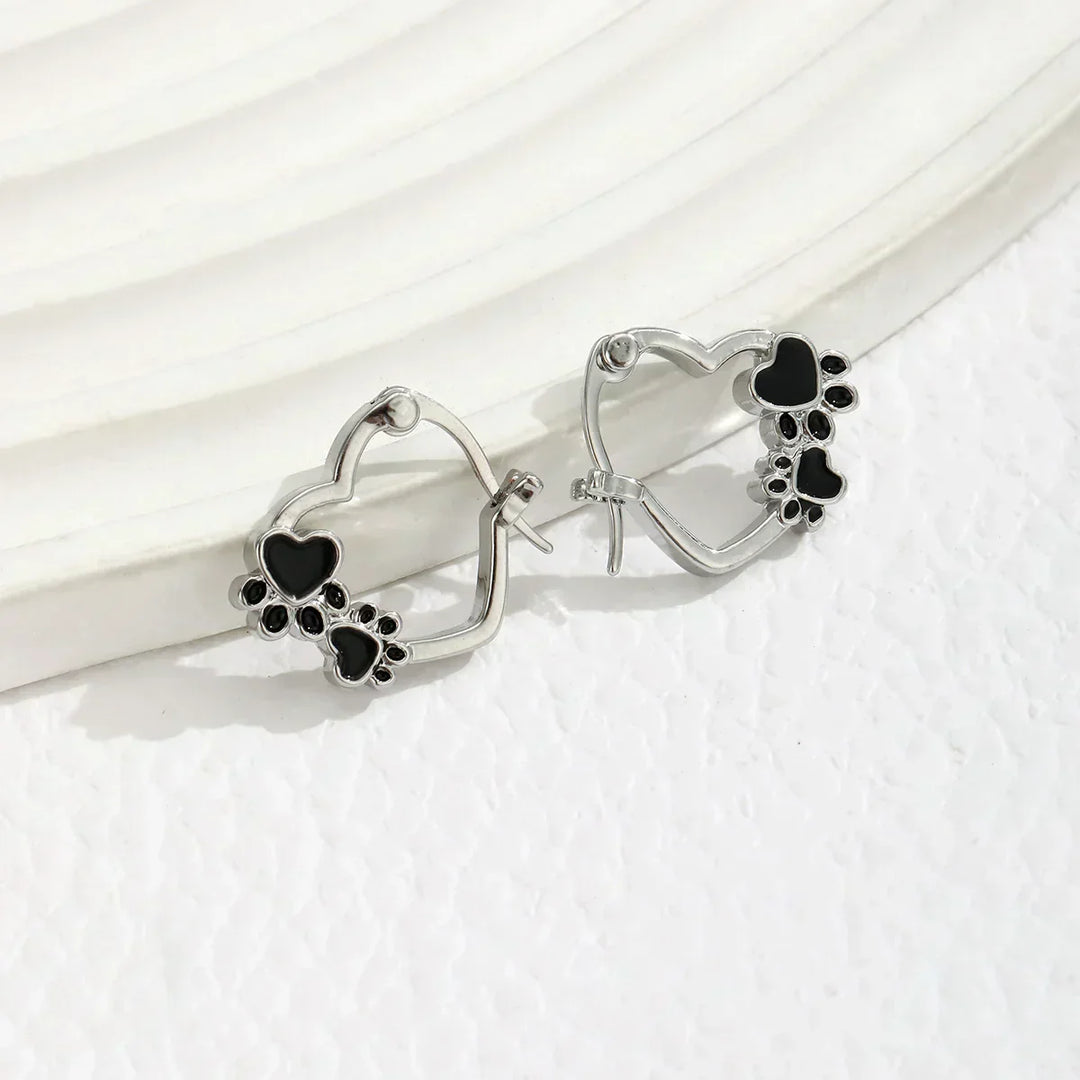 Huggie earrings with hearts and black enamel.