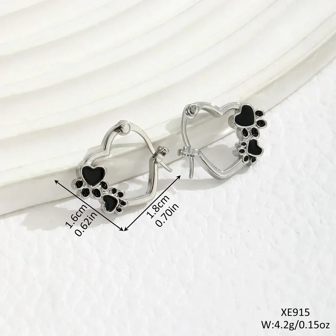 Huggie earrings with hearts and black enamel.