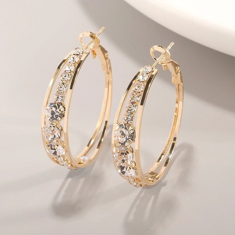 Soft gold earrings with delicate decoration