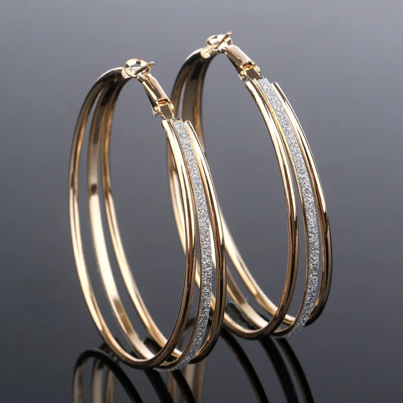 Elegant gold earrings with sparkling zirconia