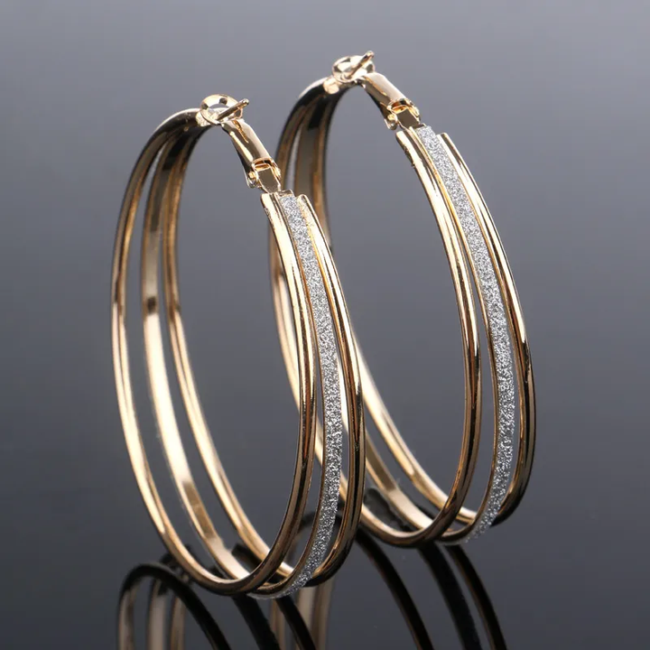 Elegant gold earrings with sparkling zirconia