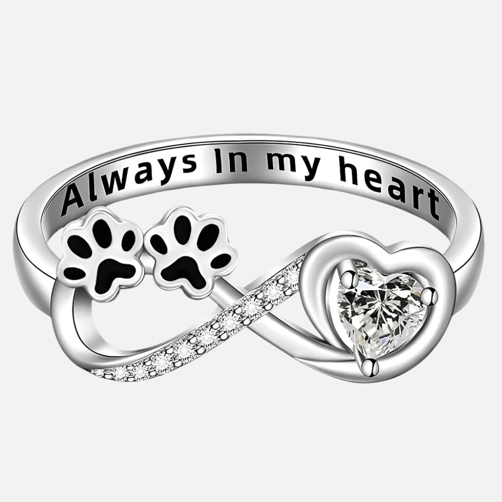 Ring with paw-shaped zirconia stones, heart and infinity symbol.
